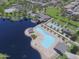 Aerial view of community amenities including a large pool, lake, clubhouse, and recreation areas at 44125 W Cydnee Dr, Maricopa, AZ 85138