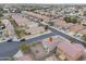 An aerial view shows a neighborhood with single-Gathering homes, desert landscaping, and tiled roofs at 44125 W Cydnee Dr, Maricopa, AZ 85138