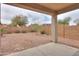 View of backyard patio showing gravel landscaping and block wall at 44125 W Cydnee Dr, Maricopa, AZ 85138