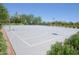 Outdoor basketball court featuring multiple hoops and mature landscaping, great for recreational play and exercise at 44125 W Cydnee Dr, Maricopa, AZ 85138
