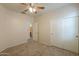 Comfortable bedroom with closet, neutral tones, ceiling fan and carpet flooring at 44125 W Cydnee Dr, Maricopa, AZ 85138