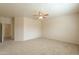A bedroom with neutral carpet, large space, and neutral paint at 44125 W Cydnee Dr, Maricopa, AZ 85138