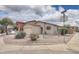 Charming single-Gathering home featuring desert landscaping, a two-car garage, and a neutral color palette at 44125 W Cydnee Dr, Maricopa, AZ 85138