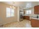 Open kitchen with stainless steel appliances, eat-in dining area and tile floors at 44125 W Cydnee Dr, Maricopa, AZ 85138