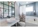 This bathroom features modern fixtures, a marble countertop, and a shower-tub combo at 4639 E Mulberry Dr, Phoenix, AZ 85018