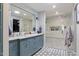 This bathroom features double sinks, a walk-in shower, and designer tile flooring at 4639 E Mulberry Dr, Phoenix, AZ 85018
