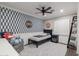 This bedroom features a ceiling fan and decorative accent wall at 4639 E Mulberry Dr, Phoenix, AZ 85018