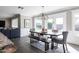 Elegant dining room boasts natural light, stylish table, and views of the outdoor pool at 4639 E Mulberry Dr, Phoenix, AZ 85018