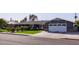 Charming home with manicured lawn, red brick accents and a two car garage at 4639 E Mulberry Dr, Phoenix, AZ 85018