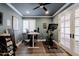 Inviting home office featuring a modern desk, exercise bike, and hardwood floors, perfect for work and workouts at 4639 E Mulberry Dr, Phoenix, AZ 85018
