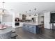 Bright kitchen with a central island, stainless steel appliances, and pendant lighting at 4639 E Mulberry Dr, Phoenix, AZ 85018