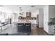 Modern kitchen featuring a brick backsplash, stainless steel appliances, and island with seating at 4639 E Mulberry Dr, Phoenix, AZ 85018