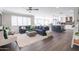 Spacious living room that flows into a kitchen featuring a cozy sofa, and decorative pillows at 4639 E Mulberry Dr, Phoenix, AZ 85018