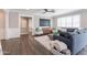 Bright living room showcasing a plush sofa, stylish ottoman, and elegant window shutters at 4639 E Mulberry Dr, Phoenix, AZ 85018