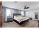 This primary suite offers a decorative accent wall and wood-look floors at 4639 E Mulberry Dr, Phoenix, AZ 85018