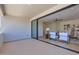 Balcony leading to a living area, decorated with chairs and a table, providing a nice space to relax at 4640 E Glenrosa Ave, Phoenix, AZ 85018