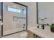 Stylish bathroom with a soaking tub, frameless glass shower, and modern vanity with black accents at 4640 E Glenrosa Ave, Phoenix, AZ 85018