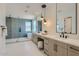Bright bathroom boasts dual sinks, a glass enclosed shower, and a modern soaking tub at 4640 E Glenrosa Ave, Phoenix, AZ 85018