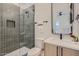 Bathroom features a modern glass shower, sleek fixtures, and gray vertical tile at 4640 E Glenrosa Ave, Phoenix, AZ 85018