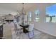 Elegant dining room with a modern chandelier and large windows at 4640 E Glenrosa Ave, Phoenix, AZ 85018