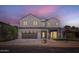 Stunning two-story home featuring a modern design, multi-car garage, and neatly landscaped front yard at 4640 E Glenrosa Ave, Phoenix, AZ 85018