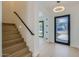 Bright entryway with hardwood floors, staircase, modern lighting, and views to the exterior at 4640 E Glenrosa Ave, Phoenix, AZ 85018