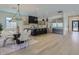 Expansive kitchen open to the dining room featuring stainless appliances, a large island, and sleek cabinetry at 4640 E Glenrosa Ave, Phoenix, AZ 85018
