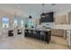 Modern kitchen features a central island with bar stool seating and stainless steel appliances at 4640 E Glenrosa Ave, Phoenix, AZ 85018