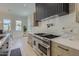 Gourmet kitchen features a high-end stainless steel range and light wood cabinetry at 4640 E Glenrosa Ave, Phoenix, AZ 85018