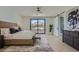 Spacious main bedroom with mountain view features barn door leading to modern bathroom at 4640 E Glenrosa Ave, Phoenix, AZ 85018