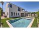 Backyard with a pool, artificial grass and landscaping, providing a private oasis for relaxation and recreation at 4640 E Glenrosa Ave, Phoenix, AZ 85018