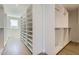 Spacious walk-in closet with custom shelving, drawers, and ample storage for an organized wardrobe at 4640 E Glenrosa Ave, Phoenix, AZ 85018