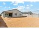 View of the backyard, showing the property line and patio area of the house at 5046 W Karl St, San Tan Valley, AZ 85144