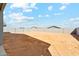 Large backyard with block fencing and blue skies at 5046 W Karl St, San Tan Valley, AZ 85144