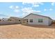 Backyard view with the house, patio, and surrounding landscape at 5046 W Karl St, San Tan Valley, AZ 85144