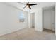 Neutral bedroom with a ceiling fan, carpet floors, and a window with blinds at 5046 W Karl St, San Tan Valley, AZ 85144