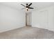 Standard bedroom featuring carpet, ceiling fan, and double door closet at 5046 W Karl St, San Tan Valley, AZ 85144