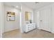 Bright foyer with wood-look tile flooring, white wainscoting, and contemporary art at 5046 W Karl St, San Tan Valley, AZ 85144