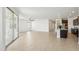 Expansive open-concept space features sliding glass doors and seamless flow to the kitchen at 5046 W Karl St, San Tan Valley, AZ 85144