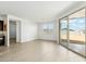 Bright open living room area with sliding glass doors leading to the backyard at 5046 W Karl St, San Tan Valley, AZ 85144