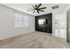 A main bedroom has carpet floors, an accent wall, a ceiling fan, and a TV at 5046 W Karl St, San Tan Valley, AZ 85144