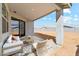Covered patio features outdoor furniture and open backyard at 5046 W Karl St, San Tan Valley, AZ 85144