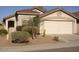 Single level home with a beige stucco finish, desert landscaping, and a two car garage at 5050 E Roy Rogers Rd, Cave Creek, AZ 85331