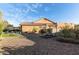 Landscaped backyard with gravel, artificial turf, pool and covered patio perfect for entertaining at 5215 S Monte Vista St, Chandler, AZ 85249