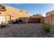 Low maintenance backyard with gravel, wall, and gate; ideal for desert landscaping at 5215 S Monte Vista St, Chandler, AZ 85249