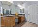 Large primary bathroom with dual sinks, wood cabinets, a walk-in shower and tile floors at 5215 S Monte Vista St, Chandler, AZ 85249