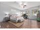 Large main bedroom features wood floors, a seating area and several large windows for natural light at 5215 S Monte Vista St, Chandler, AZ 85249