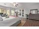 Well-lit main bedroom features wood floors, a ceiling fan and access to an outdoor patio at 5215 S Monte Vista St, Chandler, AZ 85249