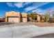 Charming single-story home with a three-car garage, desert landscaping, and a spacious driveway at 5215 S Monte Vista St, Chandler, AZ 85249