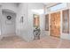 Inviting foyer with tile flooring, a decorative wood door, and a view into the home at 5215 S Monte Vista St, Chandler, AZ 85249